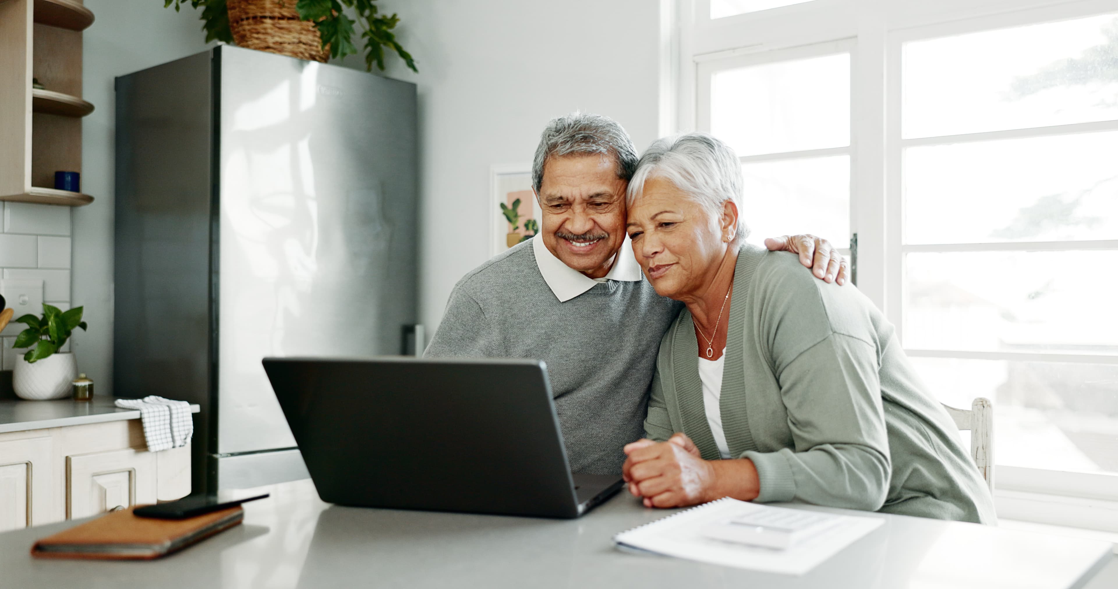 Couple reviewing trust information on a laptop